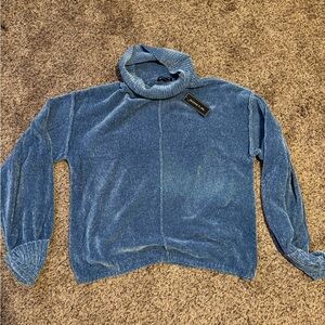BRAND NEW turtle neck sweater. Blue. Size XL but fits smaller